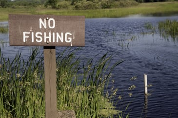 Warning sign by pond in Illinois state park